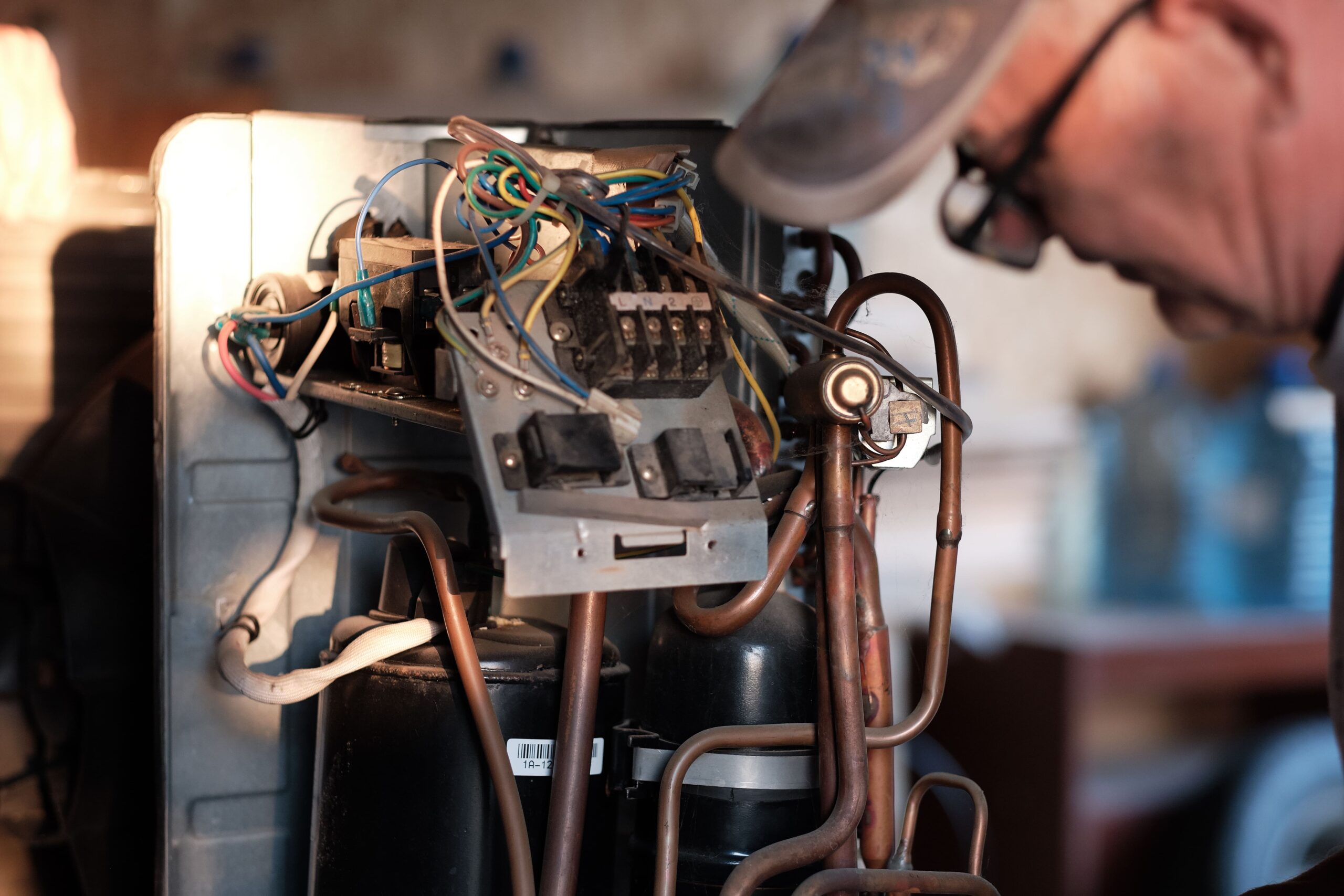 a man looking at a circuit breaker